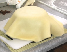 Marzipan draped over cake